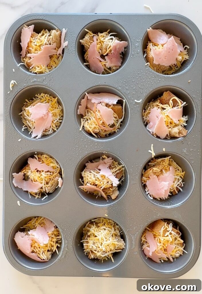 Morning Muffin Bites 5 Adding shredded cheese and sliced ham into the bread-lined muffin tin