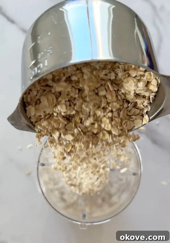 Step-by-step image of blending ingredients for blueberry waffles