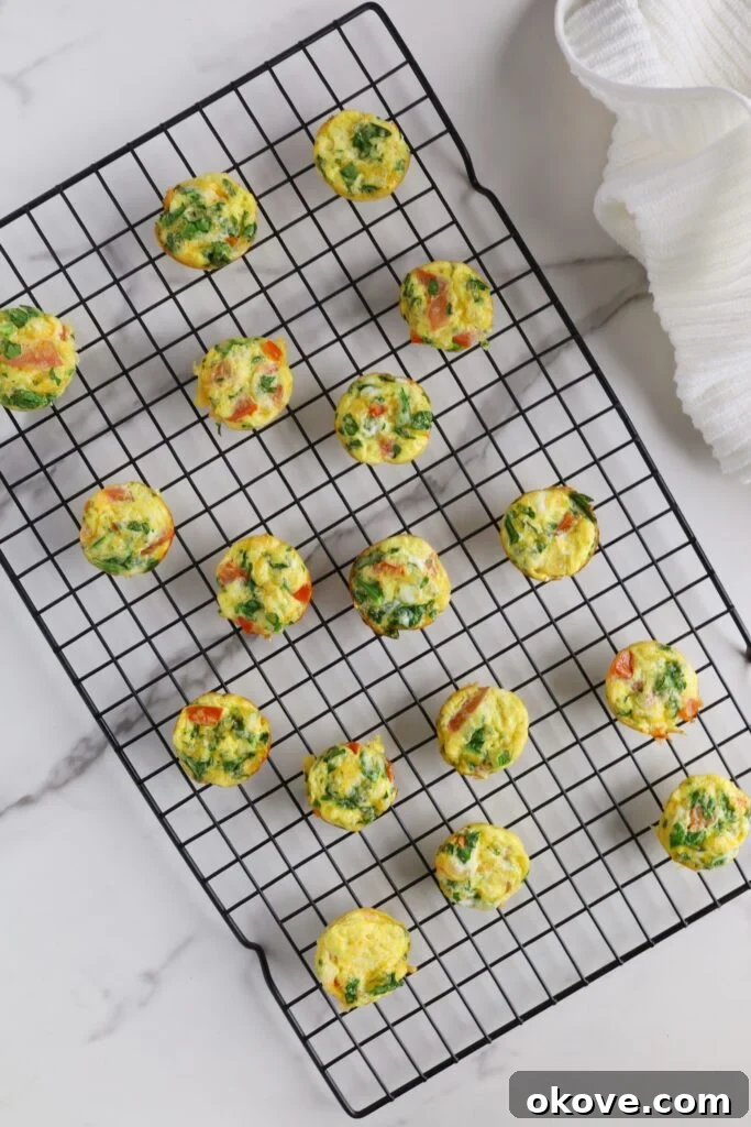 Spinach tomato bites on a cooling rack