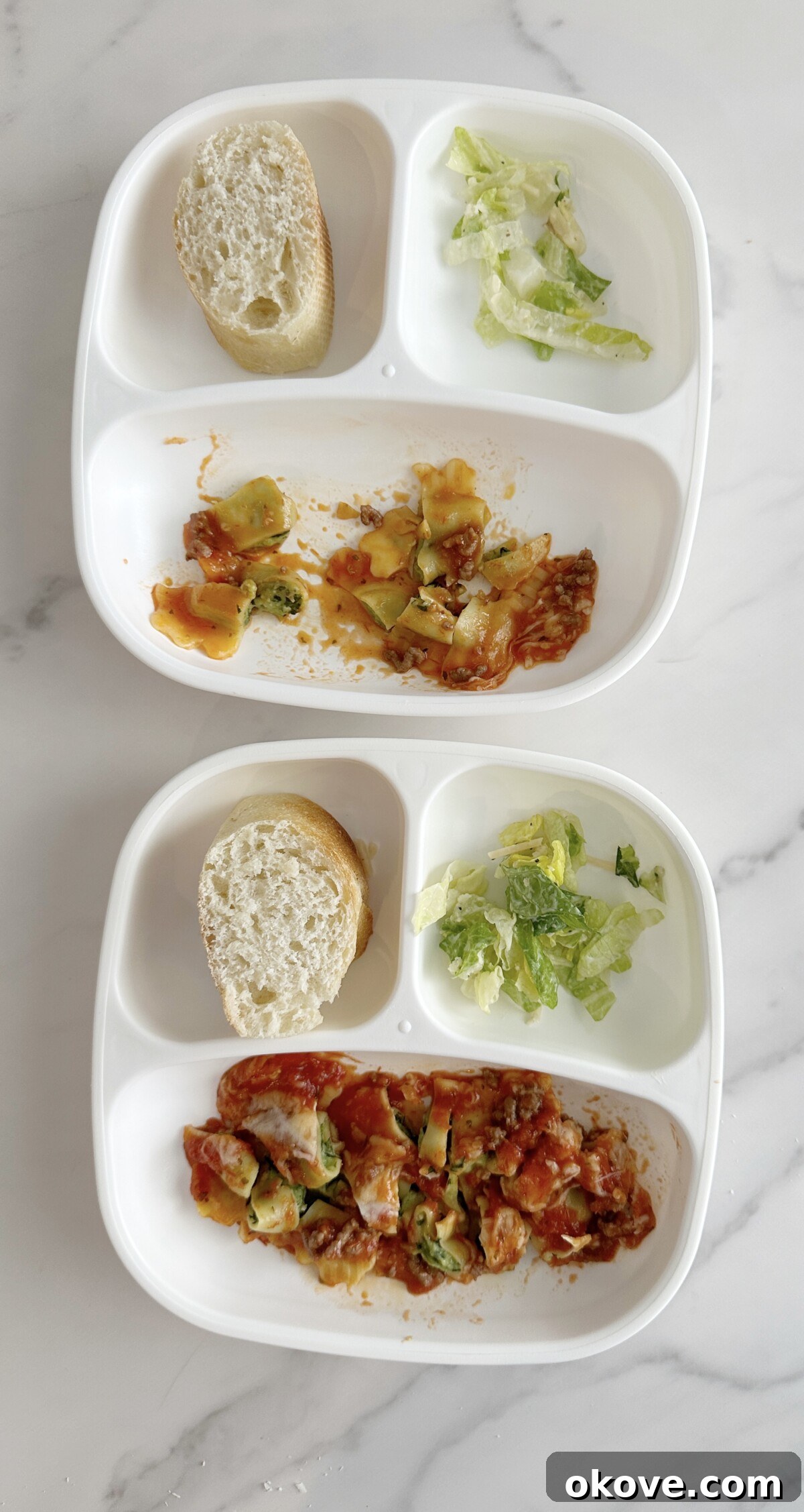 Two divided plates with toddler-sized portions of cut-up ravioli lasagna, a small side salad, and pieces of bread, demonstrating a practical and appealing way to serve the meal to young children.