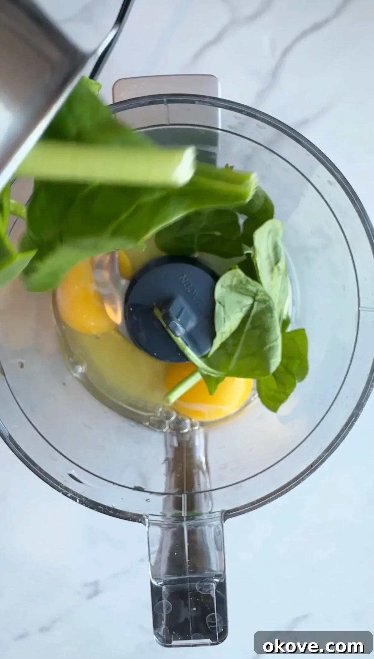The blended spinach and egg mixture, showcasing its smooth, green consistency.
