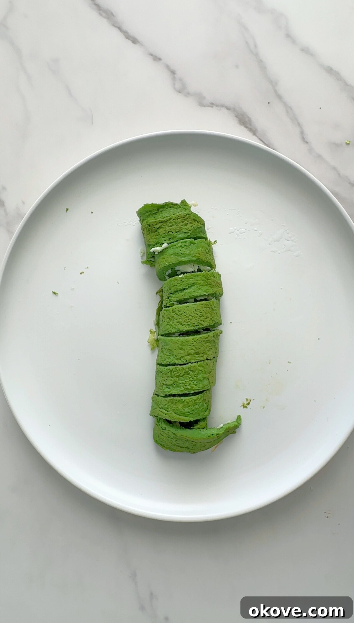 Several sliced Hulk Roll Ups arranged on a plate, ready to be served.
