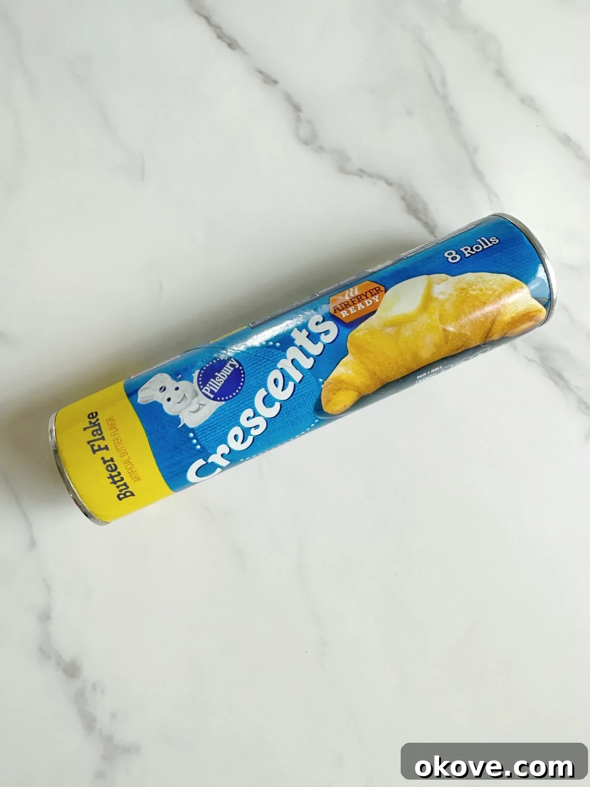Savory Pizza Spirals 4 Unrolled Pillsbury crescent roll dough laid flat on a surface, ready for toppings, showcasing the smooth, seamless sheet.