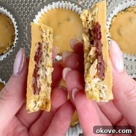Peanut Butter and Jelly Baked Oat Muffins 3 Hands holding two halves of a pb&j oat cup