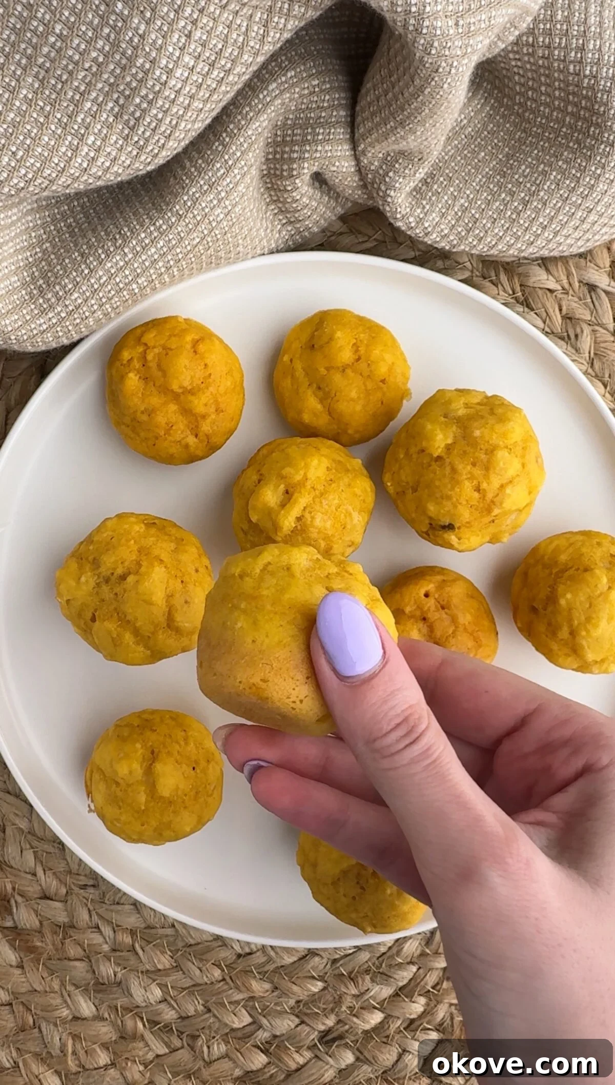 Little Bites of Banana Carrot Goodness 2 A plate of golden-brown banana carrot mini muffins, perfect for toddlers and kids