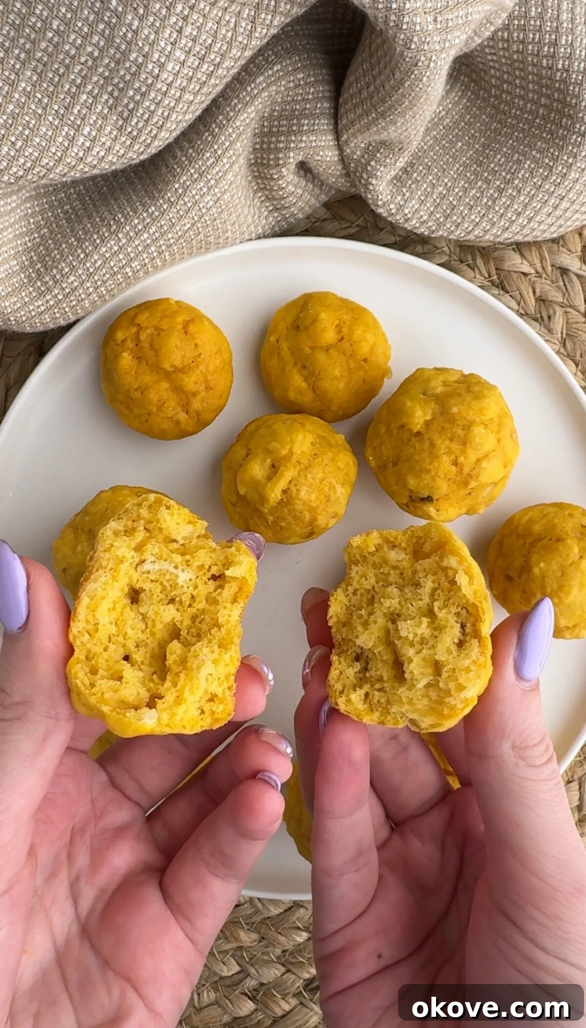Little Bites of Banana Carrot Goodness 3 A freshly baked banana carrot mini muffin split in half, revealing its moist and tender interior