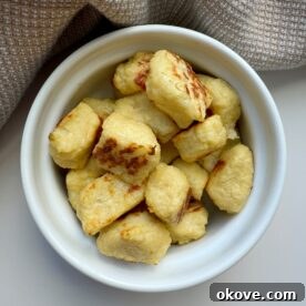 A close-up image of crispy cauliflower nuggets arranged appealingly.