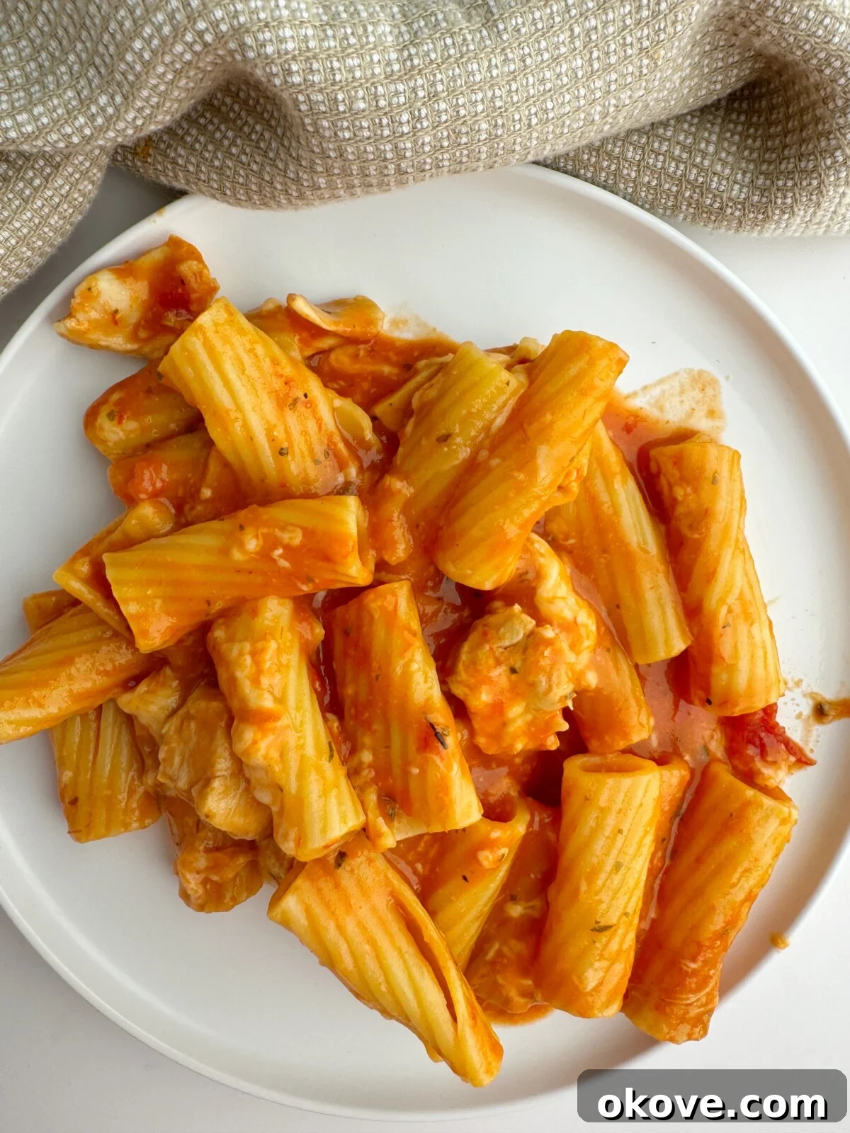 Parmesan Chicken Pasta Casserole 2 A delicious serving of Chicken Parmesan Pasta Bake on a plate, ready to be enjoyed.