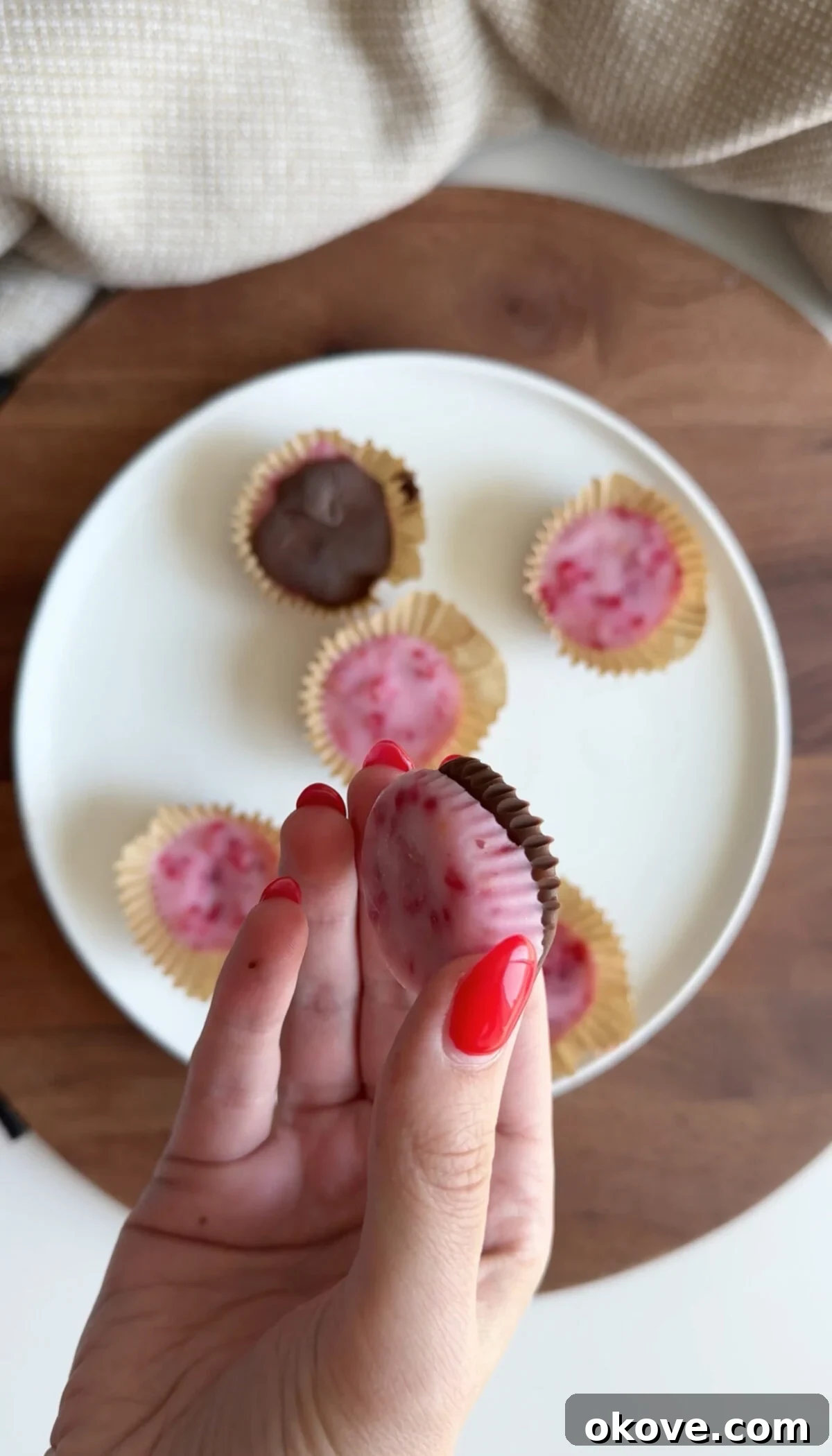 Frozen Raspberry Yogurt Drops 3 Close-up of frozen raspberry yogurt bites with chocolate drizzle