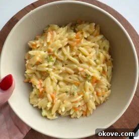 easy veggie orzo in a white bowl