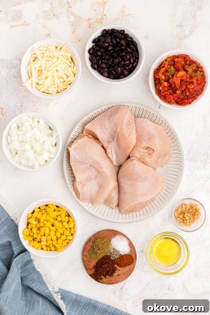 Ingredients needed to make Cowboy chicken, measured out into small white bowls on a marble table.