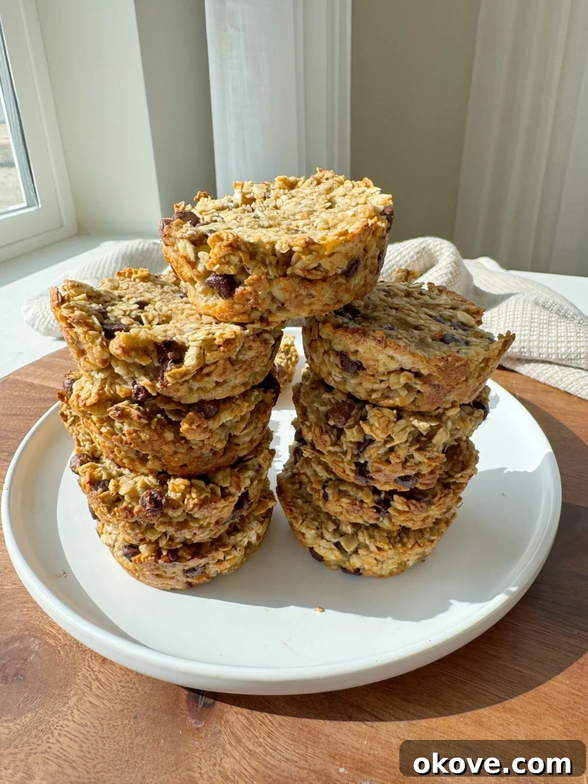 Hearty Morning Oat Muffins 2 Stacked healthy breakfast oat muffins on a plate, ready for toddlers and families