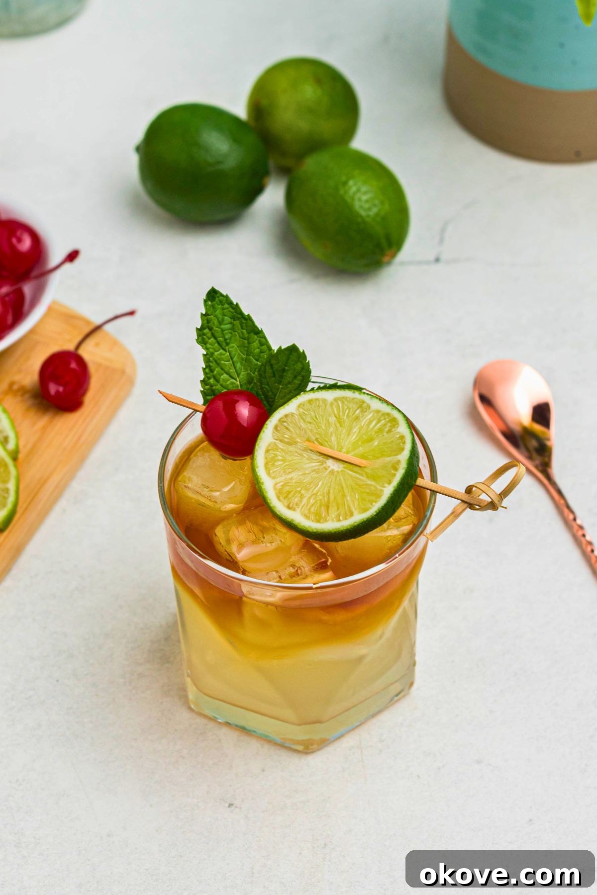 Mai Tai: Sip of the South Seas 8 An inviting overhead view of a perfectly crafted Mai Tai cocktail, garnished with a cherry and a lime slice, ready for enjoyment.