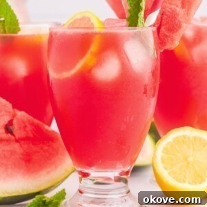 Fourth of July Recipes for a Memorable BBQ & Fireworks Night 16 Glasses filled with ice cubes and a pink lemonade, topped with a watermelon slice and pink striped straws.