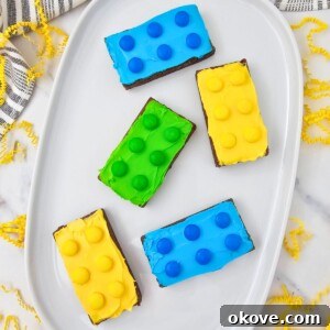 Bright Lego brownies frosted and topped with candy.