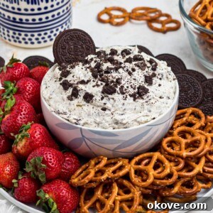 Cookies and cream Oreo dip with strawberries and pretzels.