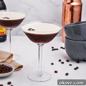 Espresso martini in a martini glass with coffee beans.