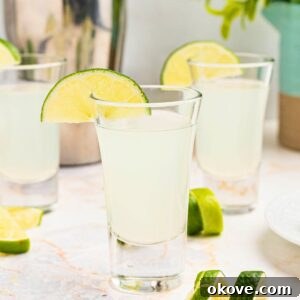 Kamikaze shots with lime wedges.