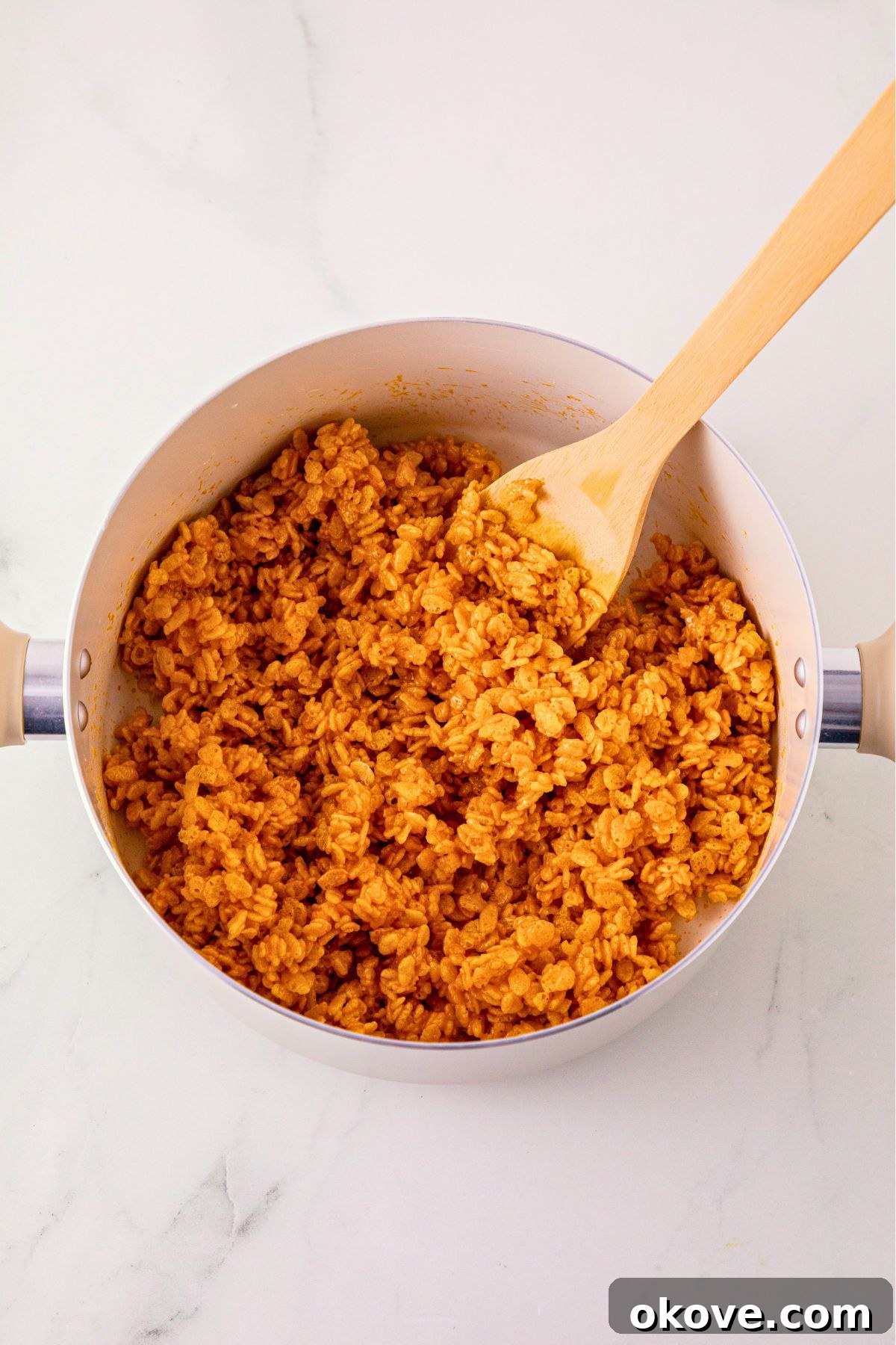 Marshmallows and rice krispies mixed together with pumpkin and butter mixture.
