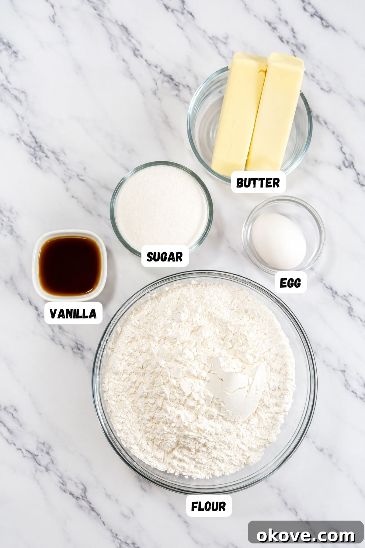 Game-Day Football Cookies: Recipes and Decorating Ideas 3 Ingredients measured into small glass bowls on a marble surface