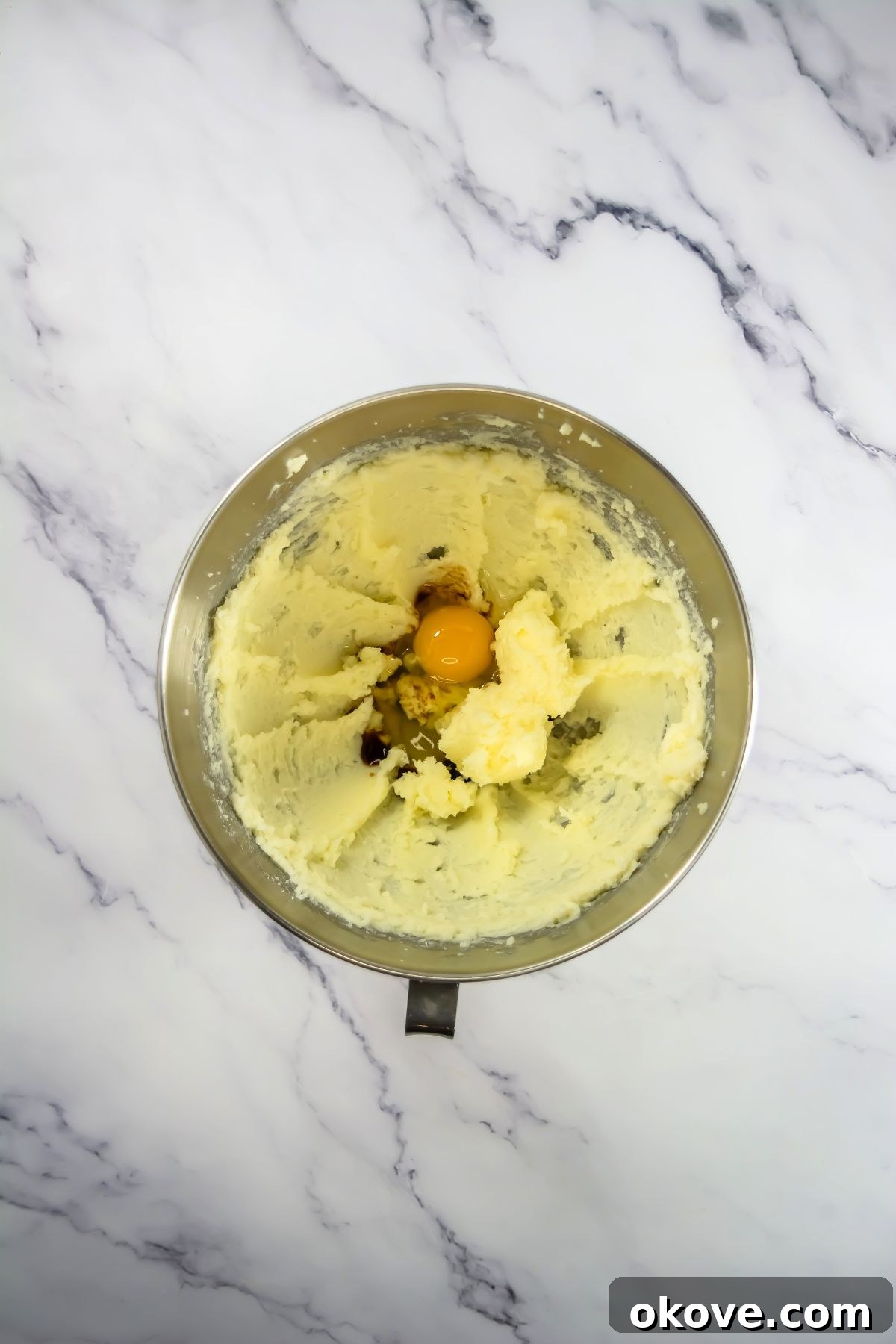 Game-Day Football Cookies: Recipes and Decorating Ideas 5 Egg and vanilla being combined in a mixing bowl