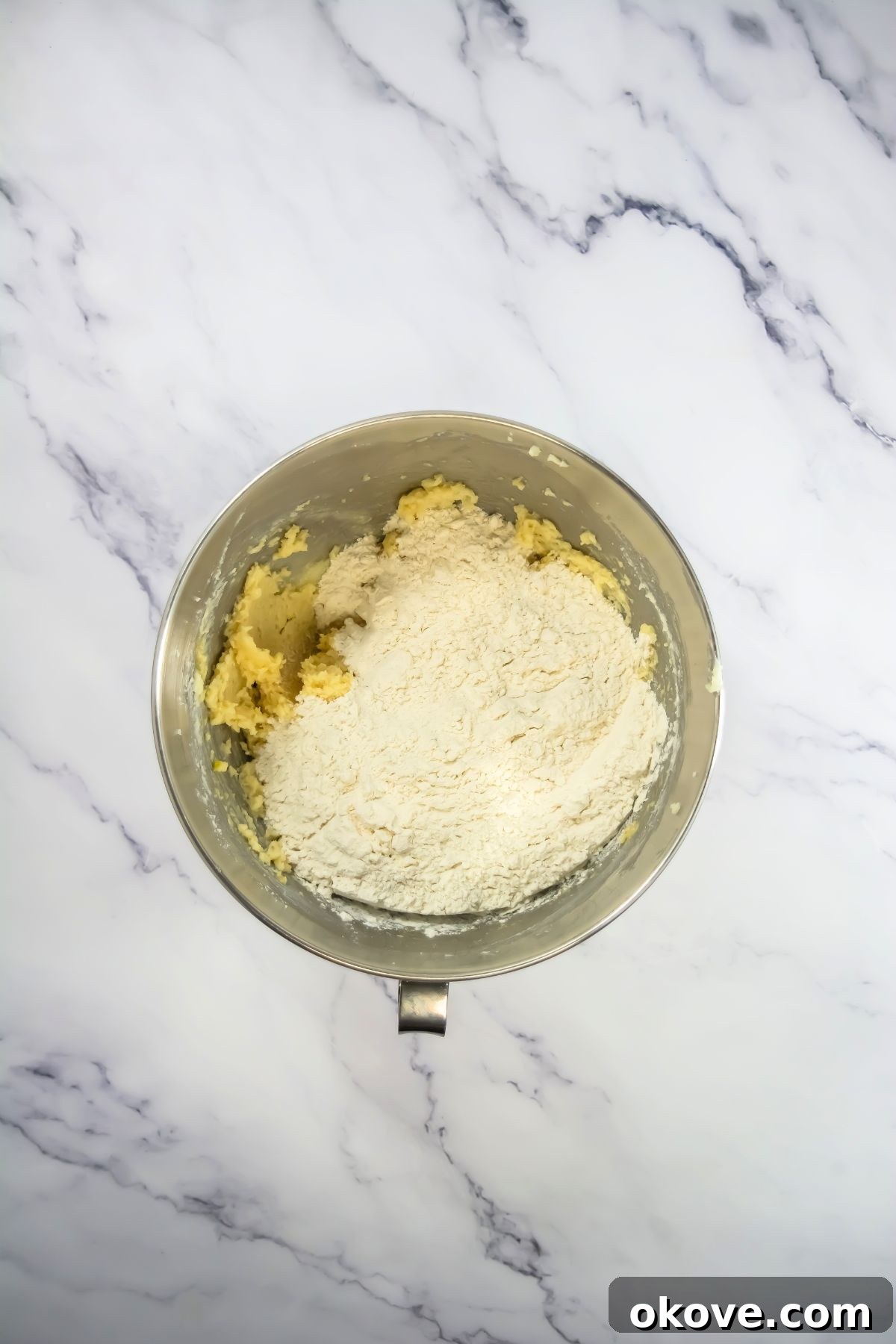Game-Day Football Cookies: Recipes and Decorating Ideas 6 Flour being added to cookie dough