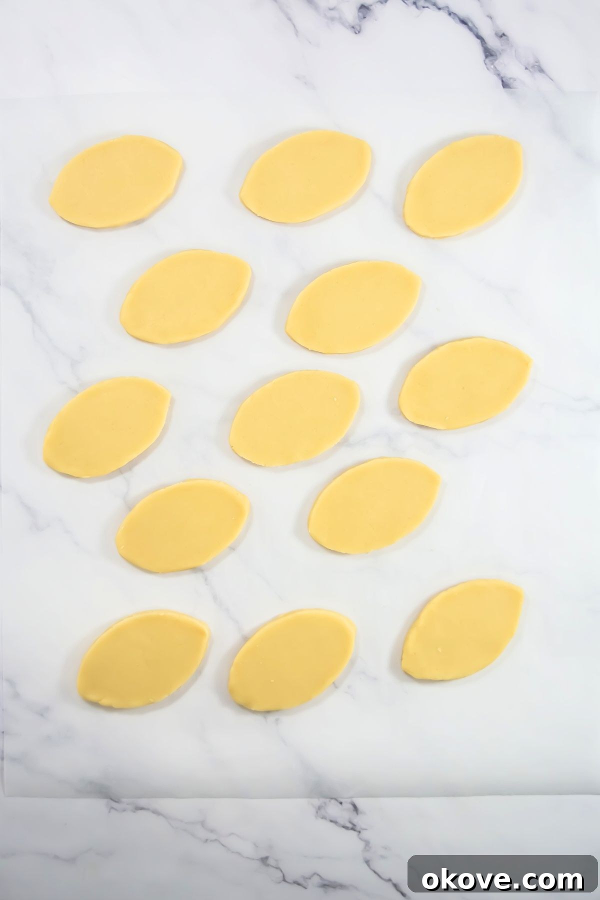Game-Day Football Cookies: Recipes and Decorating Ideas 7 Dough rolled out and cut into football shapes