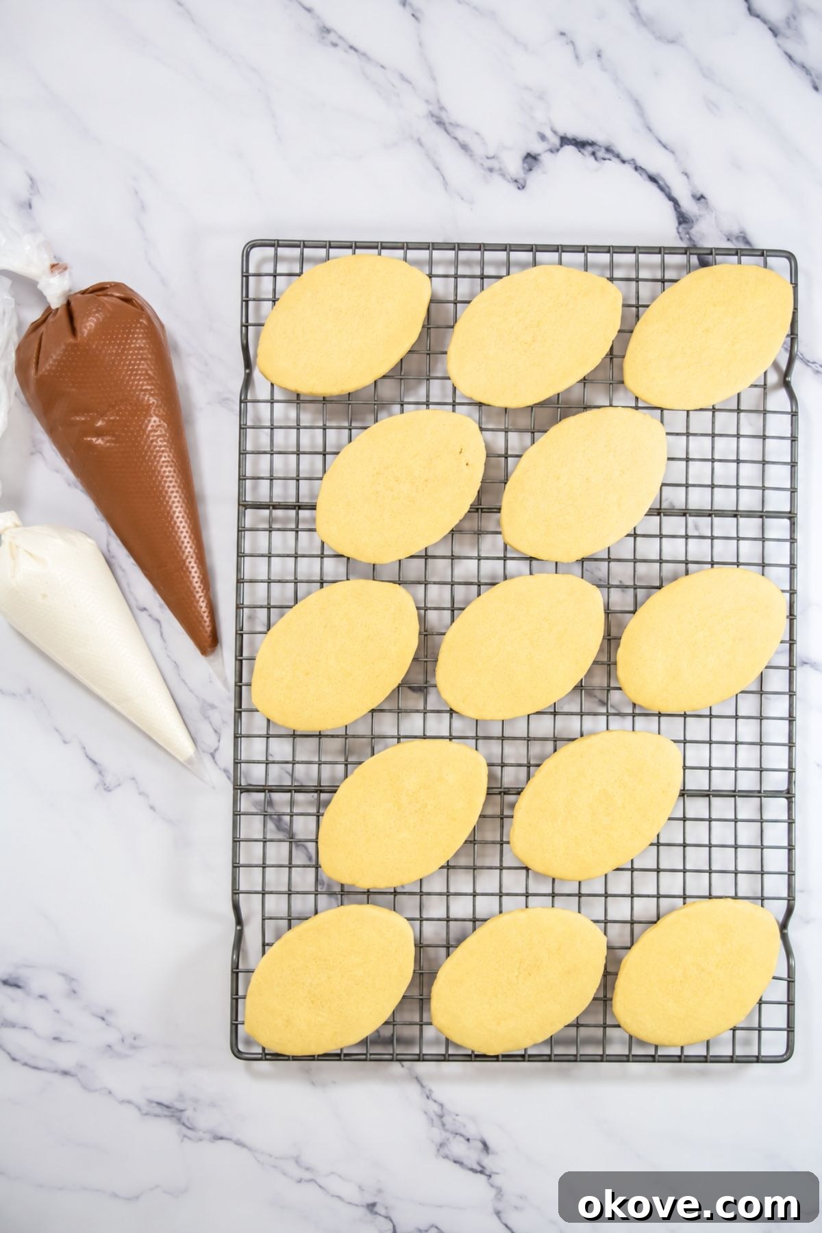 Game-Day Football Cookies: Recipes and Decorating Ideas 8 Baked cookies cooling with bags of frosting