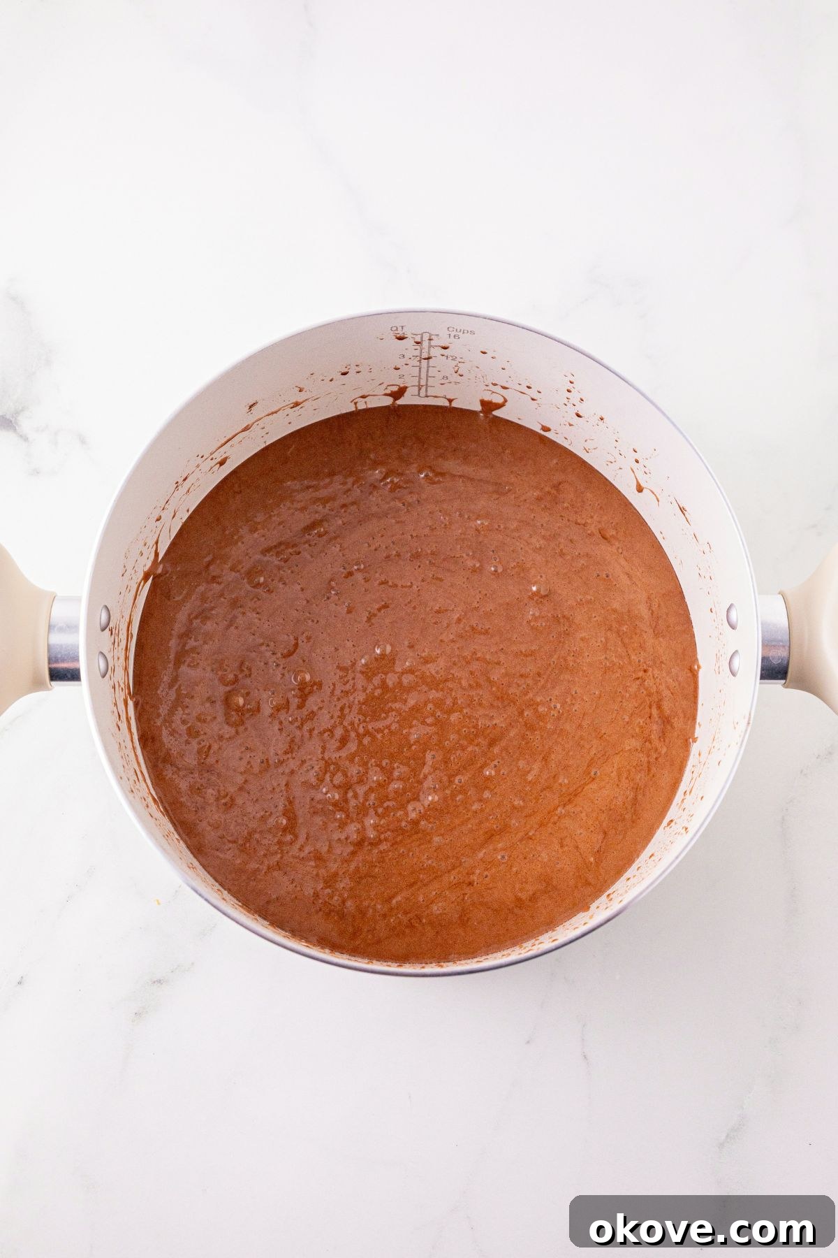Melted butter, mixed with cocoa powder, to make a light brown mixture. 