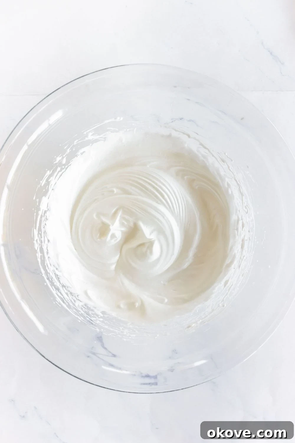 Well whisked egg whites and sugar mixed until light and fluffy in a large glass bowl. 
